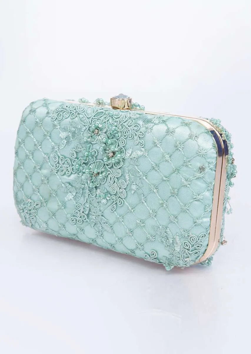 Mint green clutch with self cord, moti, cut dana and resham embroidery only on Kalki